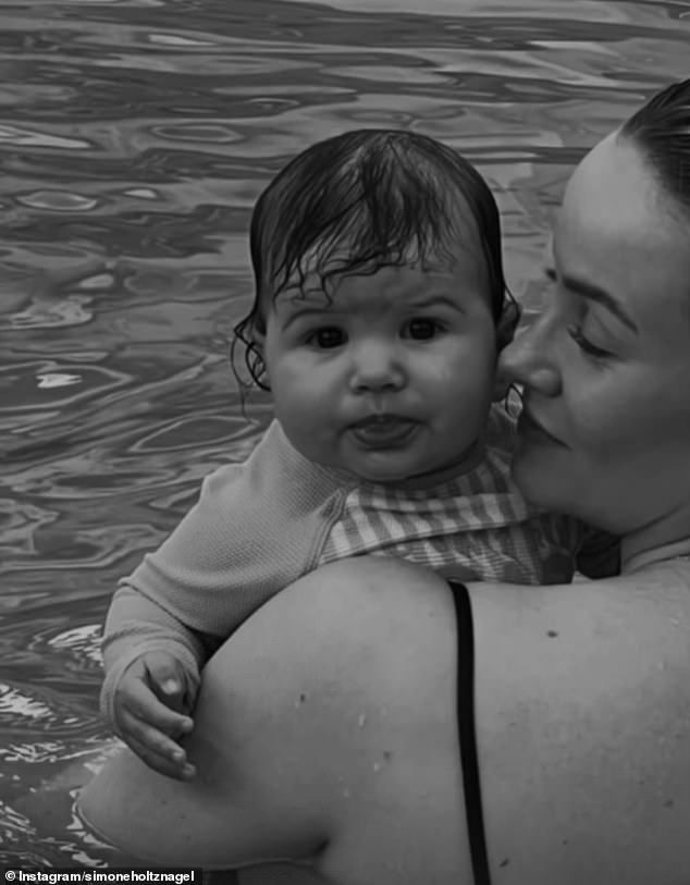 The short clip sees the genetically blessed model, 31, swimming in a pool with her five-month-old daughter Gia