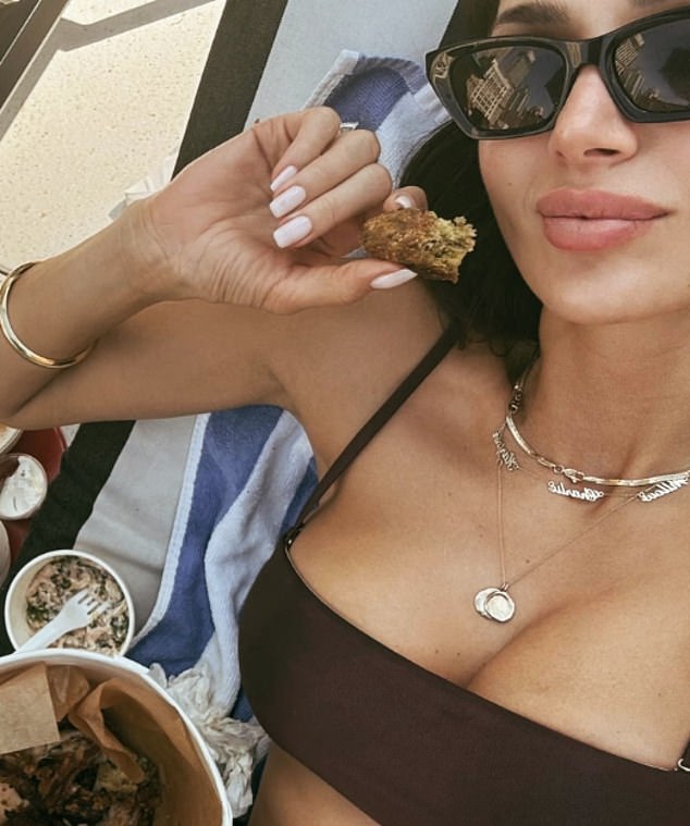 Snezana Wood has responded after being accused of pretending to eat fried chicken while showing off her incredible figure in a bikini