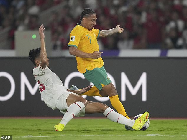 The Socceroos' FIFA World Cup qualifying campaign has been dealt another blow after they were held to a 0-0 draw by Indonesia. Australia's Samuel Silvera battles for the ball against Indonesia's Rizki Ridho Ramadhani