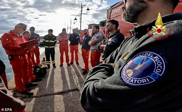 Rescue personnel pictured as they prepare to resume inspection of the wreck of the Bayesian yacht on August 23