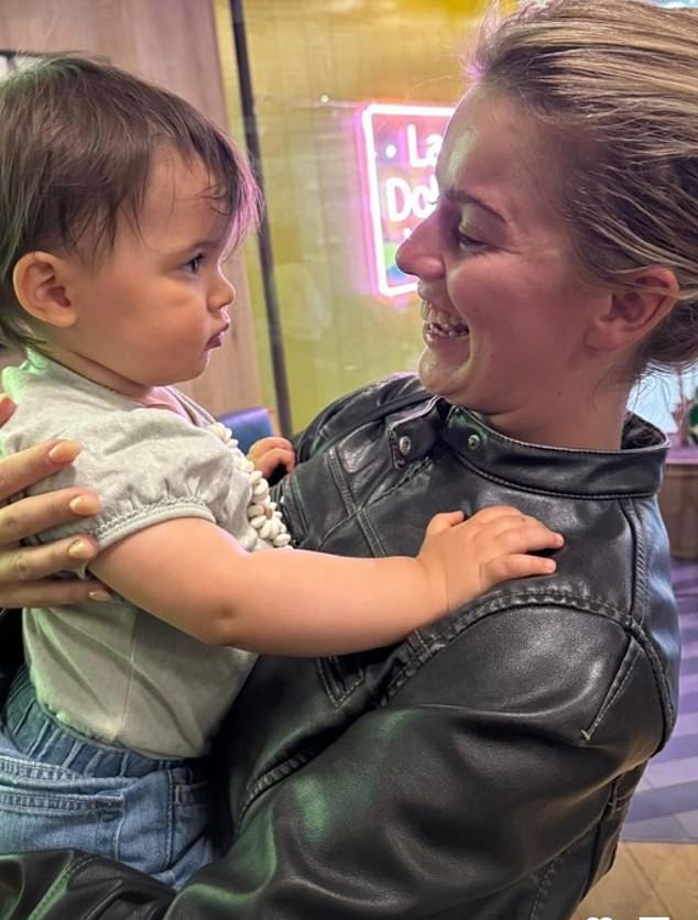 Tasha held baby Aljaz's daughter Lyra for a cuddle between dance rehearsals