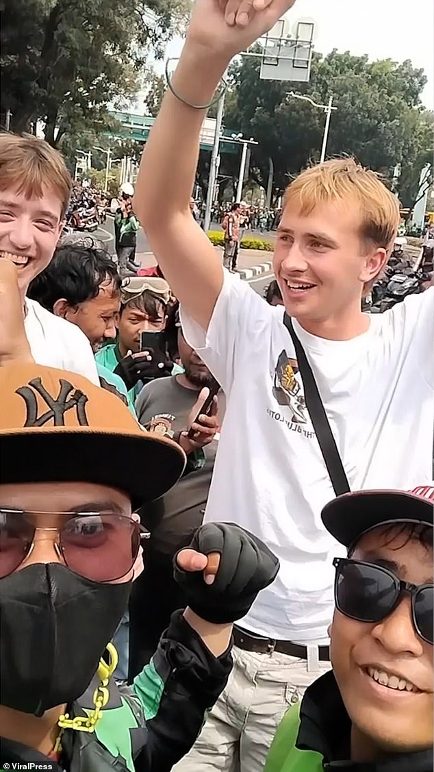 Benjamin James Lovell and his friend Benjamin Thomas Sloan cheered on the locals and even wore headbands in the capital Jakarta on August 29