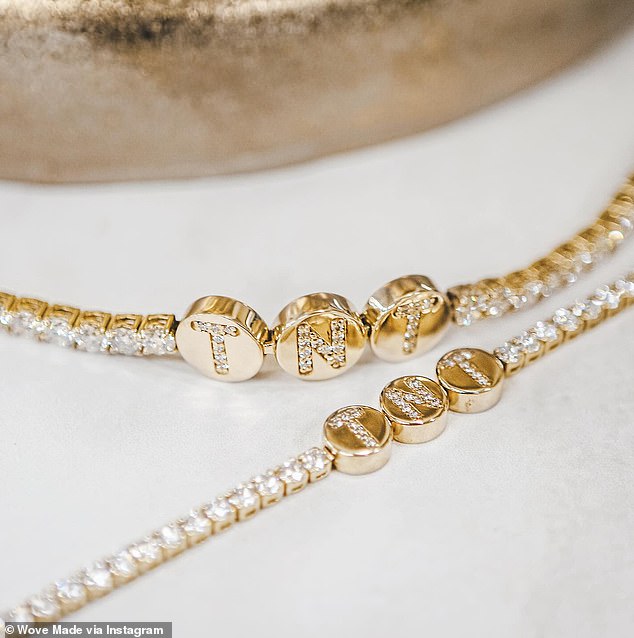 Taylor also wore the romantic TNT bracelet that Travis gave her. The diamond and gold-plated bracelet is worth about $6,000 and is believed to signify 'Travis and Taylor'