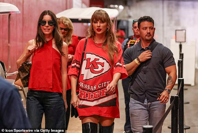 Earlier this month, she wore an oversized Chiefs shirt and black over-the-knee boots as she celebrated the Chiefs' victory over the Cincinnati Bengals (seen above).