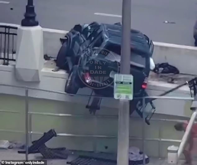 A dark green SUV exited Interstate 95 and crashed into a fence below