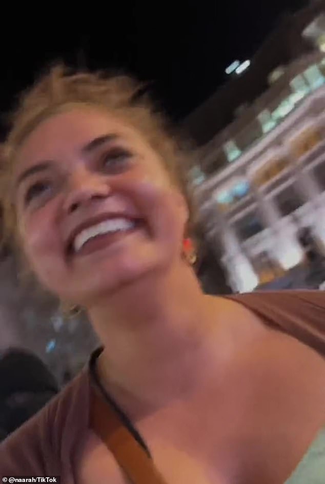 Naarah was walking down the street in central London a few days ago after a show when the masked thief (pictured over her right shoulder) tried to steal the device