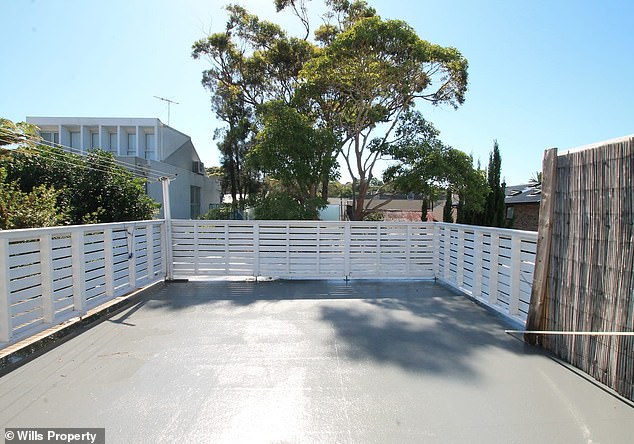 A three-bedroom apartment in Bondi Junction (pictured is the unit's balcony) has been criticised by Australians for a series of worrying details regarding its location above a childcare centre