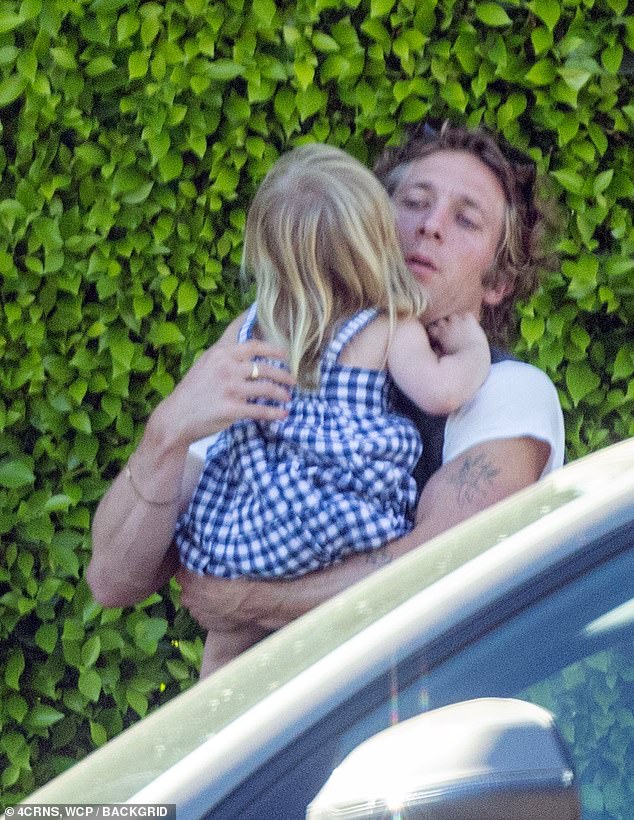 Jeremy Allen White was doting on his daughter in LA on Friday as he stepped out a day after his new romance with The Bear co-star Molly Gordon and divorce from Rosalia were revealed