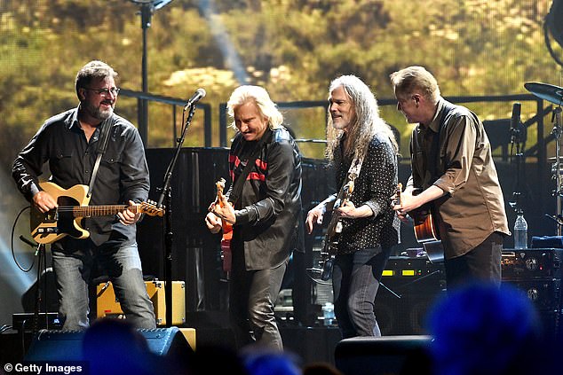 The iconic band released a heartfelt statement reflecting on the loss of their longtime friend - pictured Vince Gill, Joe Walsh, Timothy B. Schmit and Don Henley in 2018