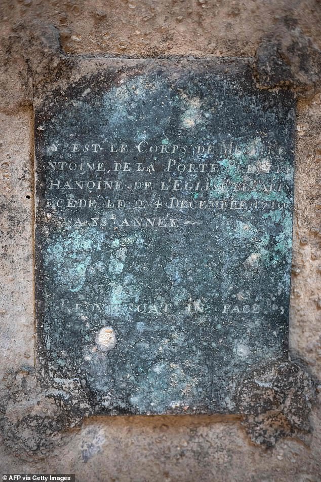 This copper plate from the priest's coffin reads: 'THIS IS THE BODY OF MESSIRE ANTOINE OF THE CANON PORTE OF THE CHURCH [word erased] DIED 24 DECEMBER 1710 IN HIS 83RD YEAR. RESQUIETCAT IN PACE'