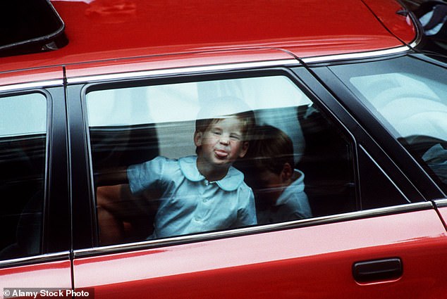 Prince Harry, almost four years old, sticks his tongue out at photographers after being taken to see his newborn niece, Princess Beatrice, 1988