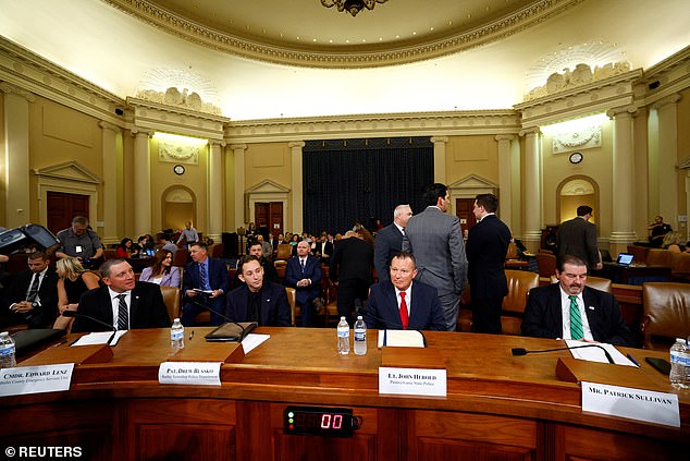 Commander Edward Lenz of the Butler County Emergency Services Unit, Patrolman Drew Blasko of the Butler Township Police Department, Lt. John D. Herold of the Pennsylvania State Police and Patrick Sullivan attend a House Task Force on the hearing into the attempted murder of Donald J. .Trump