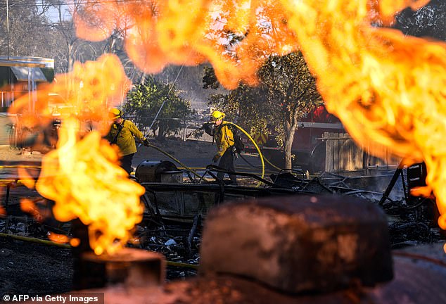 Firefighters are working to extinguish numerous homes destroyed by fire as the Boyles Fire rages in Clearlake, California