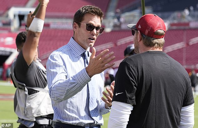 Tom Brady talks to Tampa Bay Buccaneers offensive coordinator Liam Coen before the game