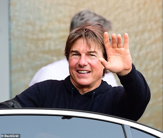 Tom Cruise, 62, appeared to be enjoying a well-deserved break with his billionaire friends as they landed in his helicopter at Battersea on Thursday