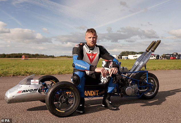 Freddie Flintoff on a motorized tricycle while filming a series of the BBC program Top Gear