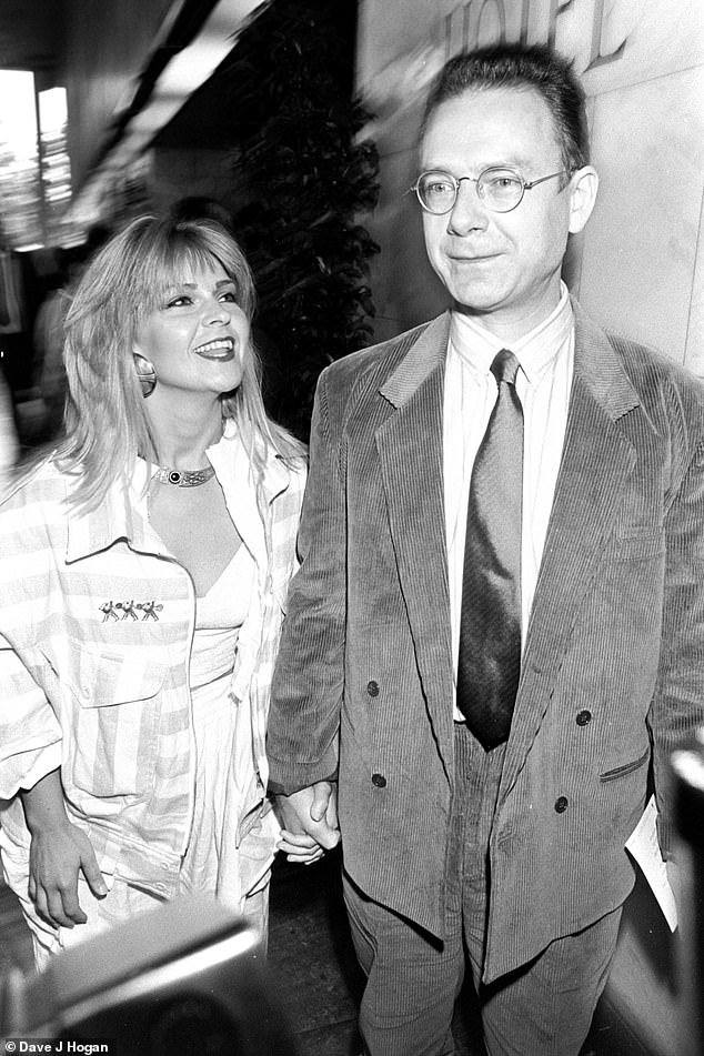 But now the singer, 66, says her intense exercise regime has caused her breasts to shrink - and her husband Robert Fripp, 78, can't be mad about it anymore (both pictured in 1987).