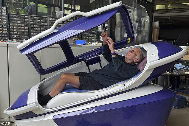 Philip Nitschke lies in a 'suicide capsule' known as 'The Sarco' in Rotterdam, Netherlands, July 8, 2024