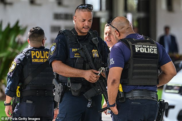 Department of Homeland Security police officers stand guard outside the Paul G. Rogers Federal Building as Routh made his plea