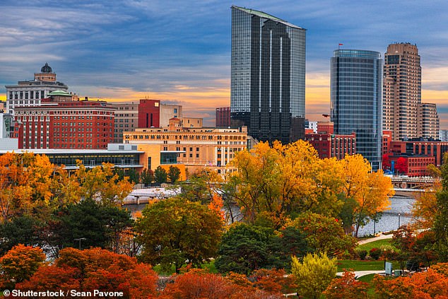 The downtown skyline of Grand Rapids, Michigan, offers stunning views of the city and surrounding nature during the peak deciduous tree season.