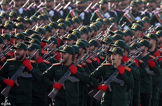 Soldiers of the Iranian Revolutionary Guard Corps (IRGC) march in formation during the annual military parade to mark the 1980 Iraqi invasion, which led to an eight-year war (1980-1988); in Tehran, Iran, September 21, 2024