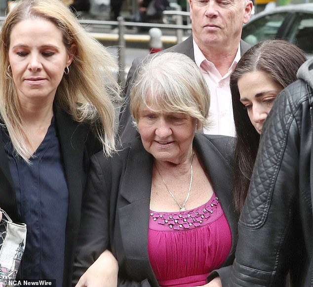 Joyleen Robinson (pictured centre in October 2023) claimed her daughter bought the property for her. On Wednesday it was claimed Mrs Robinson will not allow access to estate agents to sell it