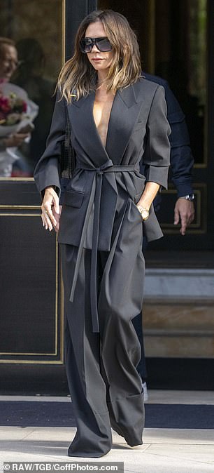 Victoria's chic blazer hugged her tiny waist and was paired with extremely wide-leg trousers