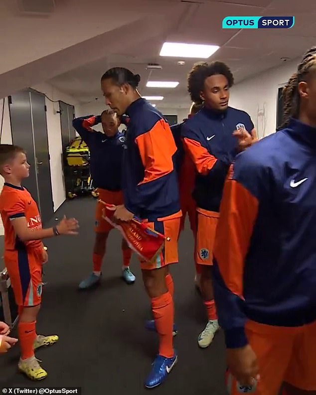 Liverpool's Virgil van Dijk (left) appeared to ignore Man United's Joshua Zirkzee (right)