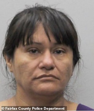 Wendi Del Cid Rodriguez, 46, (pictured) and Franklin Viera Guevara, 29, were arrested after police found two young boys, ages seven and nine, chained by their ankles to a pole in the alleged couple's Groveton, Virginia, home.