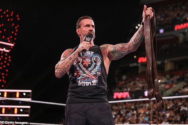 CM Punk, pictured in August 2024, received a mix of backlash and support when he posted a photo of a wall spray-painted with the words 