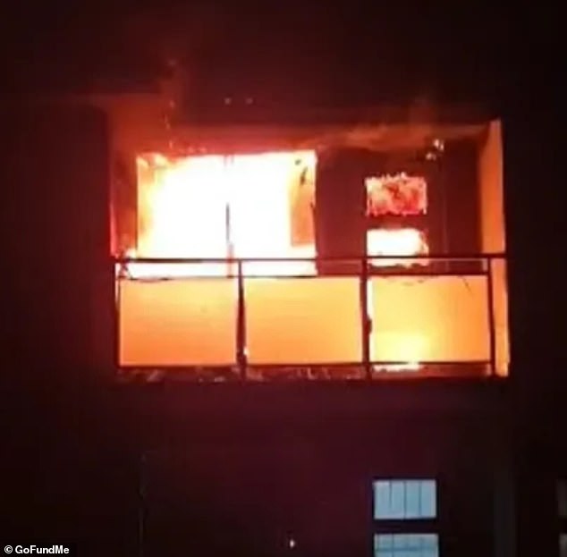 The couple's rental apartment caught fire after a neighbor's faulty cellphone charger caused an electrical outlet to explode, engulfing the entire eight-unit block (pictured)