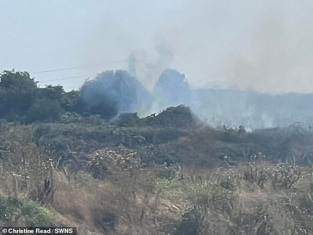 Smoking of waste from the landfill, causing an unbearable stench for the locals