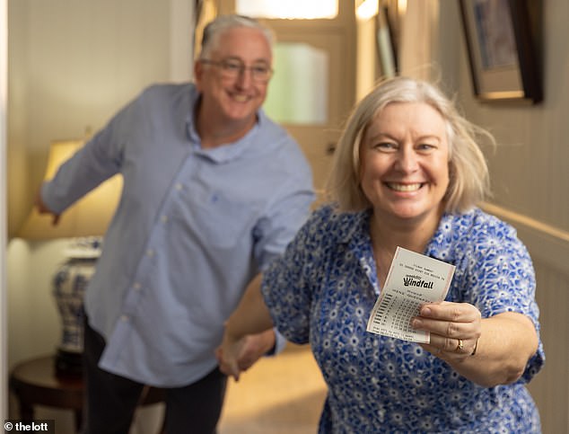 The man said he would use his winnings to fix up his house, which could use some 'TLC' (the stock photo shows a couple holding a lottery ticket)