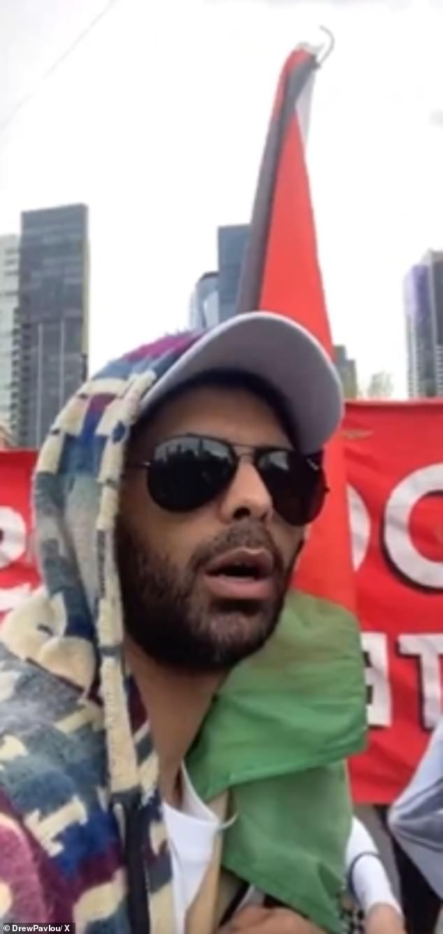 The man (pictured), who waved a Hamas flag, was one of 1,200 protesters who gathered at the Land Forces 2024 arms fair at the Melbourne Convention Centre on Wednesday morning