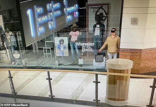 A man poses as a mannequin in Central Europe's largest shopping mall before robbing it