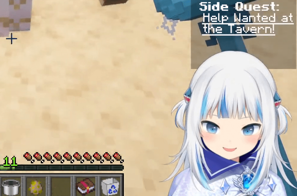 An image of Gwr Gura, a VTuber with white hair and a blue, oversized sweater that resembles a shark.