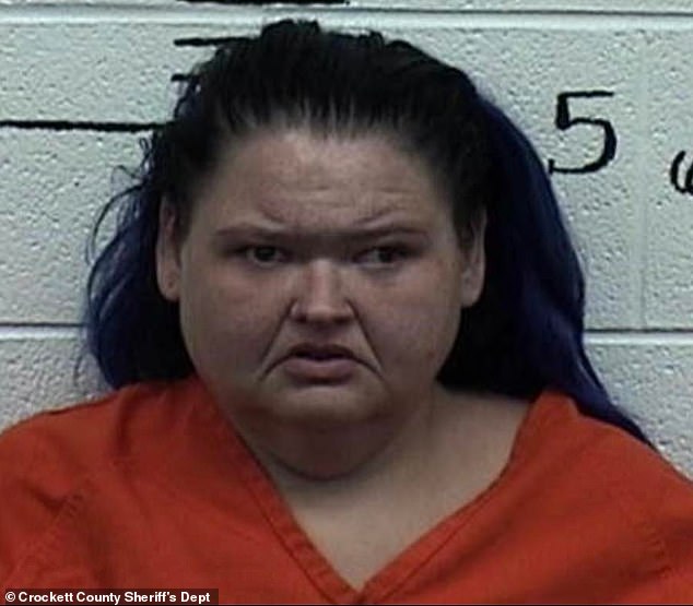 Mother-of-two Amy is seen frowning in a mugshot last month after she was arrested at the Alamo Safari Park after allegedly being bitten by a camel