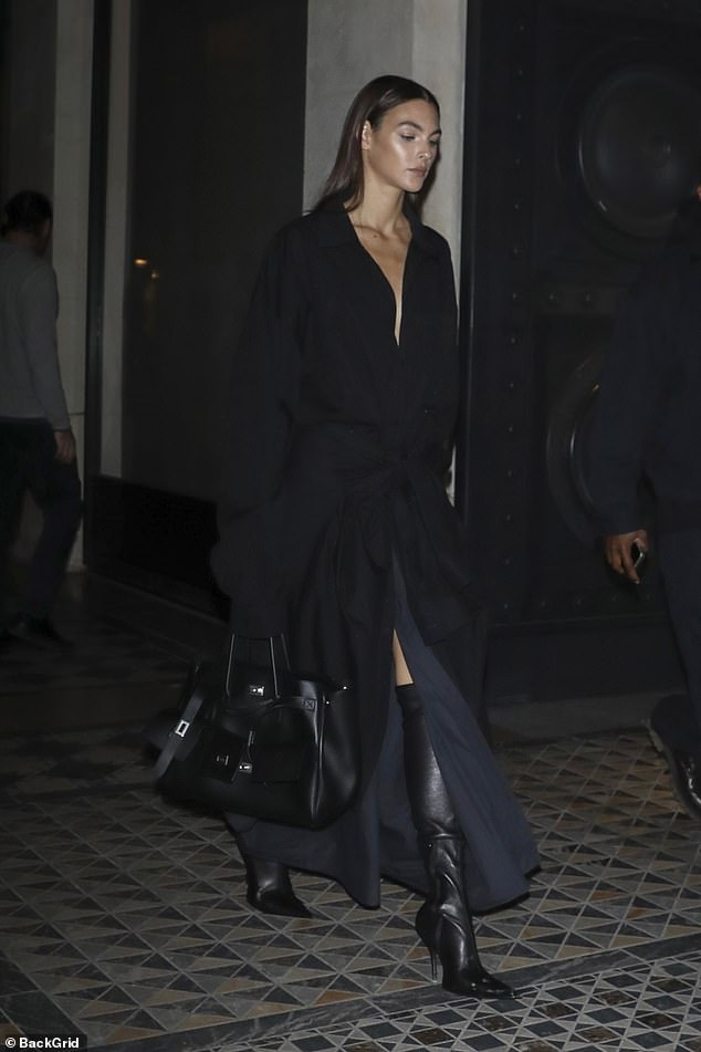 She added inches to her frame with a pair of pointed over-the-knee stiletto boots and toted her essentials in a black Hermès handbag.