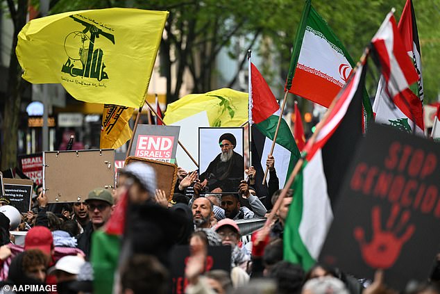 Protesters in Melbourne were seen holding up framed photos of recently murdered Hezbollah boss Hassan Nasrallah