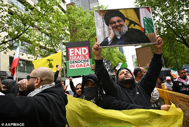 Hezbollah's yellow and green flag could also be seen as protesters waved in Melbourne