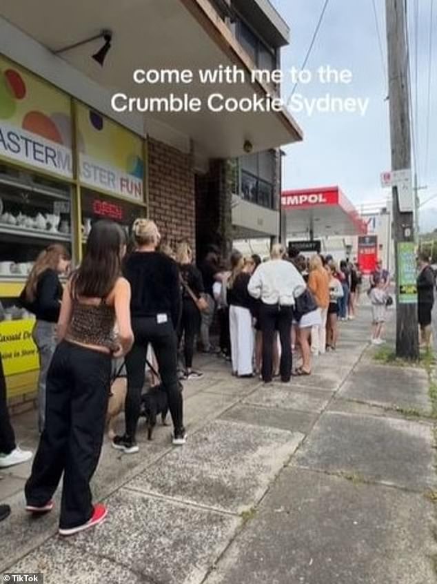 Customers queued for 'hours' to try the famous Crumbl biscuits but claimed the imported biscuits were 'stale' and 'disappointing' (pictured, queues in North Bondi on Sunday)