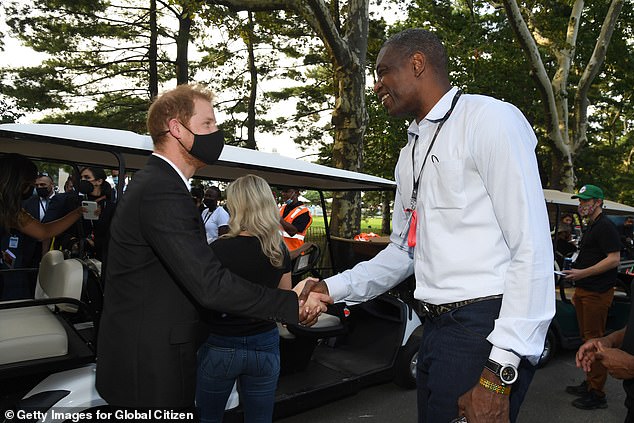 Mutombo shakes hands with Prince Harry while attending Global Citizen Live in New York