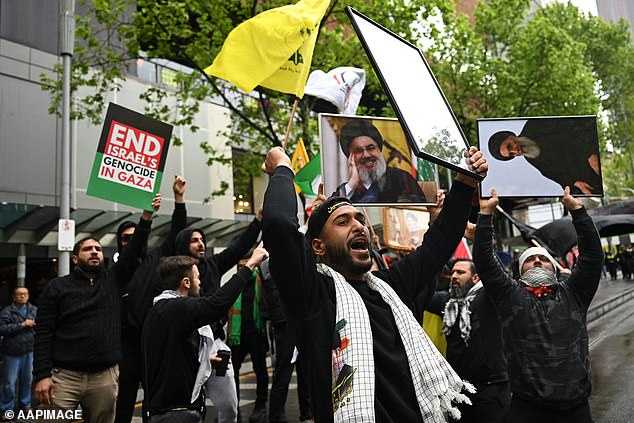 Hezbollah flags and images of Nasrallah were a common sight at the protests that also took place in Melbourne this weekend