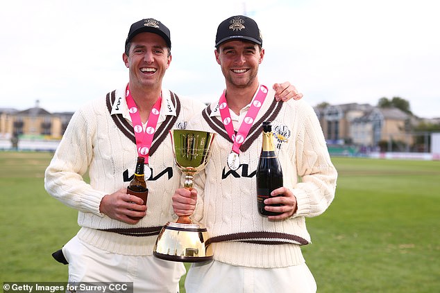 He (left) celebrated winning his third Division One title in three years with Surrey last week