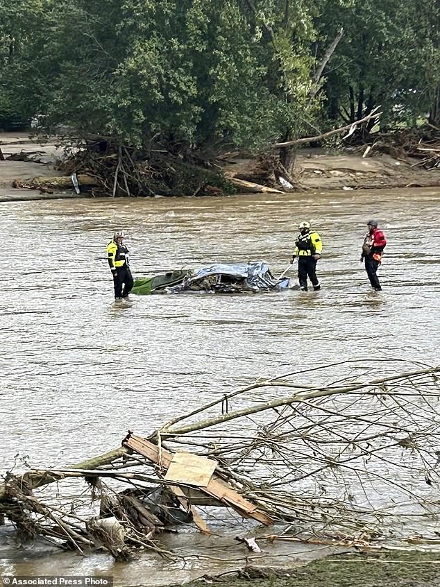 Rescuers from the Pamlico County Rescue Team work in the wake of Helene in the Chimney Rock area