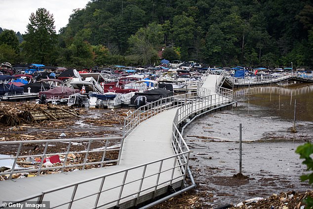 The river flows into Lake Lure, which was full of the remains of houses, trees and other debris