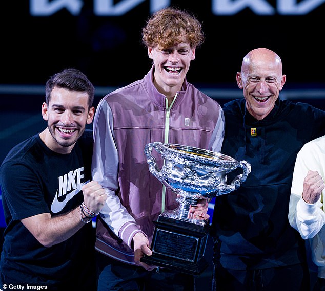 Physio Giacomo Naldi (left) and fitness coach Umberto Ferrara (right) pictured with Sinner (center) after the tennis star won the 2024 Australian Open in January