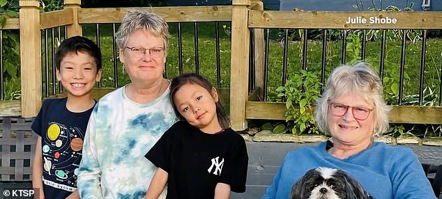 Kwok is pictured with two of her grandchildren and her sister Julie