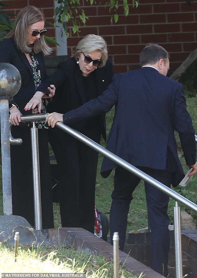 She had to be helped out of the wheelchair and down the church steps to the service