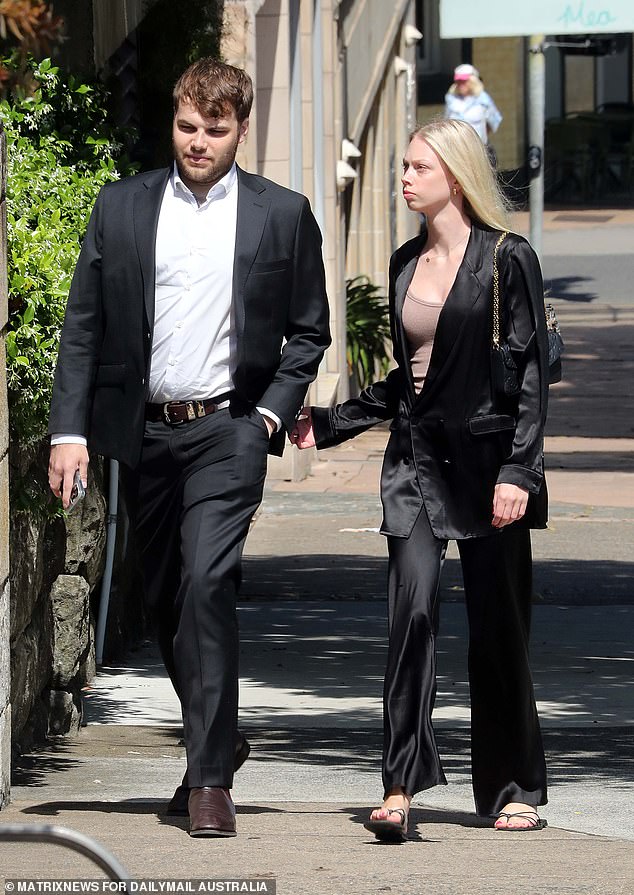 Lizzie Buttrose's youngest son James Spira and a female companion are seen arriving